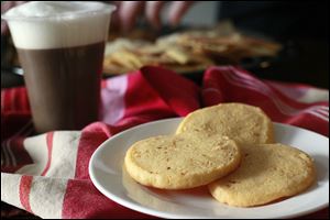 Home made cheese crackers with cappuccino.