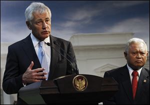 U.S. Defense Secretary Chuck Hagel, left, speaks during a joint press conference with his Indonesian counterpart Purnomo Yusgiantoro, right, after meeting with Indonesian President Susilo Bambang Yudhoyono at the presidential palace in Jakarta, Indonesia, today.