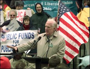 John Gilligan speaks during a public education rally in Columbus on Oct. 23, 1999. “After serving as governor, he was an elected member of the Cincinnati School Board,” state Democratic Chairman Chris Redfern said.