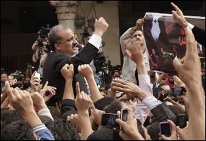 Protesters led by senior Muslim Brotherhood figure Mohammed el-Beltagy, chant slogans against the Israeli invasion of Gaza, in Al-Azhar mosque after Friday prayers, in Cairo, Egypt, in November, 2012. El-Beltagy is currently in hiding.