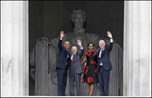 President Obama, former President Jimmy Carter, First Lady Michelle Obama, and former President Bill Clinton acknowledge the crowds as they leave the 50th Anniversary of the March on Washington. Mr. Obama’s speech invoked lofty rhetoric while Mr. Carter and Mr. Clinton discussed policy initiatives. 
