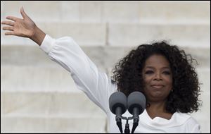 Oprah Winfrey waves as she speaks during the the 50th anniversary of the March on Washington for Jobs and Freedom on Wednesday at the Lincoln Memorial in Washington.