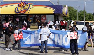 Fast-food protests were under way Thursday in U.S. cities including New York, Chicago and Detroit, seen here. Organizers say they are expecting the biggest national walkouts yet in a demand for higher wages.