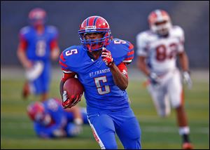 St. Francis de Sales’ Lamar Carswell breaks free for a long run during the second quarter. Carswell rushed for 179 yards in Friday’s opening night victory as the Knights ran for 289 yards.