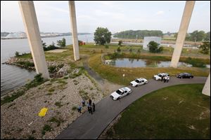 A person is dead today after apparently jumping from the Veterans Glass City Skyway and landing on the banks of the Maumee River in East Toledo. Initial reports are that the person was involved in a chase with Monroe County authorities. Toledo police and Monroe County authorities are on the scene.