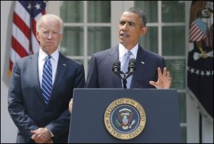 President Barack Obama stands with Vice President Joe Biden as he makes a statement about Syria in the Rose Garden today at the White House in Washington.