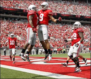 Ohio State halfback Jordan Hall (7) celebrates scoring a touchdown with WR Devin Smith (9) during the second quarter against  Buffalo today Columbus.