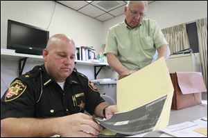 Sheriff Kyle Overmyer, left, and Chief Deputy Bruce Hirt talk about  the 1988 unsolved murder case of  Isabel Cordle, 49, who was killed at her home in 1988. The case will be featured on ‘Cold Justice.’