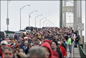 Thousands of walkers cross the 5-mile Mackinac Bridge during the annual Labor Day Bridge Walk in Mackinaw City, Mich. Labor Day is the only day pedestrians are allowed on the span, which connects Michigan’s Upper and Lower peninsulas.