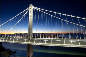 LED lights illuminate the San Francisco-Oakland Bay Bridge's  self-anchored suspension on Aug. 29 in San Francisco.