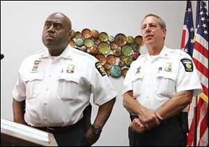 Toledo police Chief Derrick Diggs, left, and Capt. Brad Weis, discuss develop-ments in the case.
