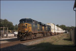 A CSX double-stack container train passes through Terre Haute, Ind., last month. Similar trains now are able to operate between northwest Ohio and central Pennsylvania because of recent bridge and tunnel improvements by CSX.