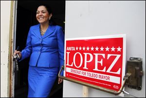 Anita Lopez leaves the Teamsters hall for some door-to-door campaigning. Her day included visits to a central-city church and a Latino club.