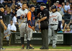Detroit Tigers' Miguel Cabrera, center left, argues with umpire Brian Gorman with Tigers manager Jim Leyland, center, after he was ejected during the first inning.