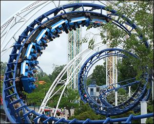 Riders enjoy the Corkscrew ride at Cedar Point amusement park in Sandusky.  The amusement park is on track for record financial results for a fourth consecutive year. 