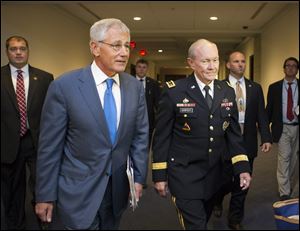 Defense Secretary Chuck Hagel, left, and Joint Chiefs Chairman Gen. Martin Dempsey, right, arrive for a closed-door intelligence briefing with members of the House of Representatives on the situation in Syria, at the Capitol, in Washington, Monday, Sept. 9, 2013. It is the first full day of legislative business for Congress as lawmakers return from the August recess and President Barack Obama is seeking congressional approval for a military strike against Syria for its use of chemical weapons in the civil war. (AP Photo/J. Scott Applewhite)
