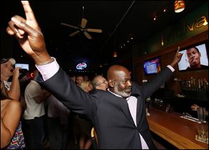 Mayor Mike Bell celebrates winning the primary election.