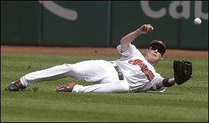 The Indians' Drew Stubbs dives for a triple hit by the Royals' Emilio Bonifacio in the first inning  on Wednesday.