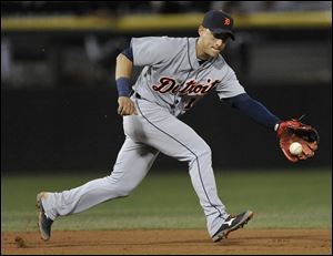 Detroit Tigers shortstop Jose Iglesias stops a ground ball hit by Chicago White Sox's Alexei Ramirez during the fifth inning.
