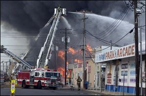 The fire started in the vicinity of an ice cream shop and burned several blocks of boardwalk and businesses in a town that was still rebuilding from damage caused by Superstorm Sandy.
