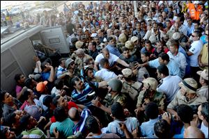 Egyptian Army soldiers respond to clashes between supporters and opponents of ousted President Mohammed Morsi in Alexandria, Egypt, today.