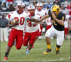 Bowsher's Kahne Collins dodges Northview's Jake Bilek. Collins gained 208 yards on xx carries and scored a touchdown.