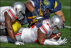 Ohio State's Michael Bennett recovers a fumble by California's Jared Goff during the first quarter.
