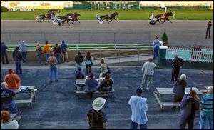 The crowd watches Saturday night at Raceway Park. The track has hosted horse racing since 1958, but the final 13 races will take place today beginning at 6 p.m.