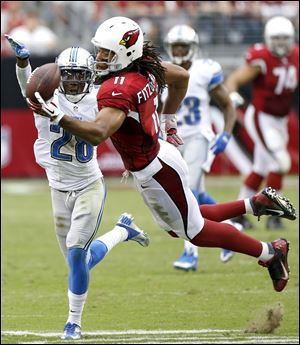 Arizona Cardinals wide receiver Larry Fitzgerald can't make the catch as Detroit Lions cornerback Bill Bentley defends during the second half today in Glendale, Ariz.