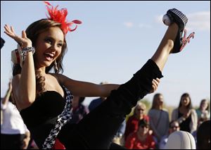 Miss Alabama Chandler Champion shows her shoe during the Miss America Shoe Parade at the Atlantic City boardwalk.