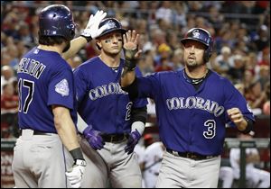 Colorado Rockies' Todd Helton (17) will retire at the end of the season after 17 years with the club.
