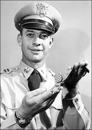 Maj. Hulon Whittington shows his Medal of Honor in 1956.