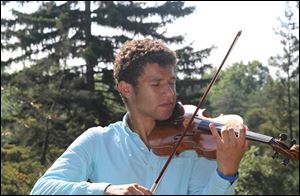 Malik Khalfani, a Maumee junior, was awarded concert master last year with the Toledo Symphony Youth Orchestra. He placed eighth at a state violin competition to earn a spot with the Ohio all-state orchestra. He made his conducting debut when he was 14.