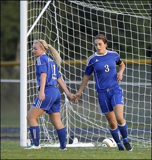 Anthony Wayne's Jessie Mattimoe, left, congratulates Abby Allen after Allen scored the first goal against Maumee. The Generals are 6-3-1, 3-0-1 in the NLL.