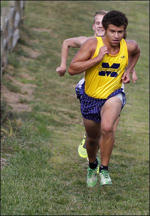 Malik Khalfani runs during practice with his team at Sidecut Metropark. Khalfani placed 13th at the Chet Sullwold Invitational at St. Francis to help the Panthers place second.