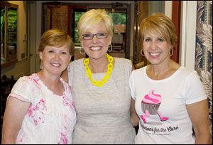 Kelli Andres, co-host, Chrys Peterson, news anchor at WTOL News 11, and Liz Allen, co-host, at the third annual Confections for the Cure event. 