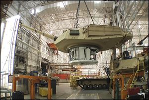The contract from Saudi Arabia to refurbish 84 U.S.-built Abrams tanks, like those above, is one of four or five international contracts the plant is working to obtain, an General Dynamics spokesman said.