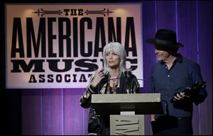 Emmylou Harris and Rodney Crowell accept the award for duo of the year during the Americana Honors & Awards show in Nashville. Harris and Crowell also won album of the year for their ‘Old Yellow Moon.’