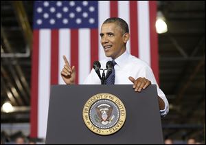 President Barack Obama traveled to the Kansas City area to visit the Ford automotive plant as he continues to highlight the progress in the economy since the 2008 financial crisis. 