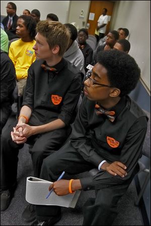 Waite student James Frankforther, left, and Bowsher's Randall Pryor listen to a speaker during the Boys to Men conference at the University of Toledo.