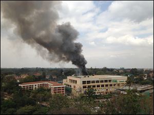 Heavy smoke rises from the Westgate Mall in Nairobi Kenya today after multiple large blasts rocked the mall where a hostage siege is in its third day.