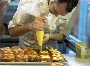 Chef Dominique Ansel makes Cronuts, a croissant-donut hybrid, at the Dominique Ansel Bakery in New York.
