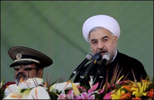 Iran's President Hassan Rouhani, gives a speech during an annual military parade in Tehran, Iran, Sunday.