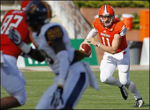 Bowling Green quarterback Matt Johnson (11) rolls out against Murray State during the second quarter Saturday.