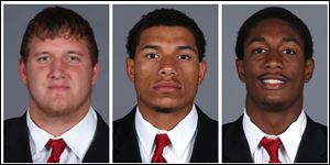 These photos taken in 2013 and provided by the University of Cincinnati on Sunday, Sept. 22, 2013, show Cincinnati football players, from left, Ben Flick, Javon Harrison and Mark Barr. 