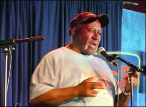 Poet  Melvin Douglas Johnson, 73, of Toledo performed in late 2011 at an event in the city. He says writing poetry helps him 'put things in perspective.'