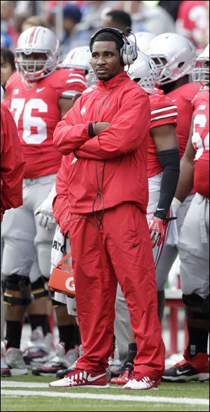 Ohio State quarterback Braxton Miller watches from the sidelines as Ohio plays against Florida A&M Saturday in Columbus.