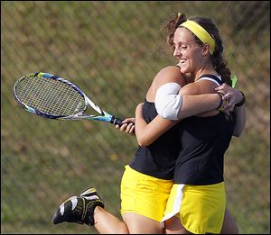 Perrysburg’s Jordan Spidel, left, and Sarah Fastnacht won in No. 1 doubles against Northview’s Kate Diment and Geeta Rao.