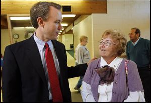 Ed FitzGerald, Cuyahoga County executive and Democratic gubernatorial candidate, talks with Sharon Belkofer, 71, of Perrysburg Township at the Chester Zablocki Senior Center in Toledo.