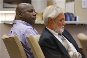 Michael Anthony Yates, left, sits with his attorney Jon Richardson during his bench trial before Judge Myron Duhart, Tuesday, September 24, 2013.